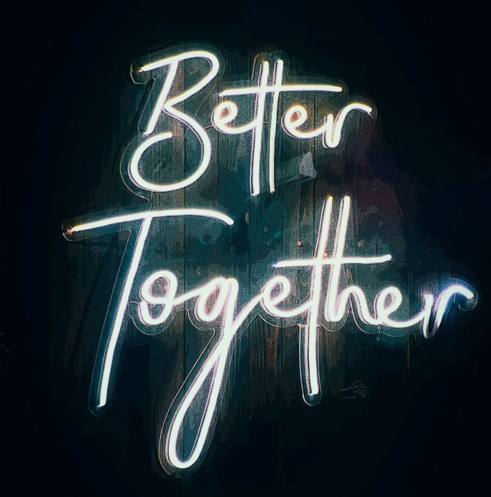 a neon sign that says better together